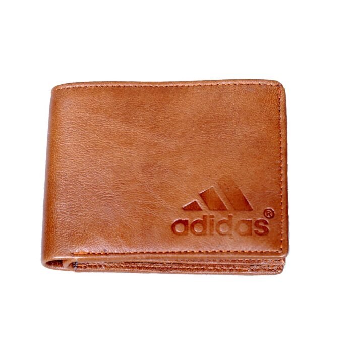 Adidas Wooden Color Leather Wallet <div class="woocommerce-product-details__short-description"> <strong>Material:</strong> The pocket is constructed from leather, which can vary in texture, thickness, and color.The leather can be smooth, pebbled, embossed, or treated to create a specific finish. <strong>Functional Uses:</strong> Leather pockets serve a variety of functional purposes, such as storing personal items, holding tools or gadgets, or providing quick access to small items. They are often found on jackets, where they might hold a wallet or phone, or on bags, where they can keep items organized. <strong>Decorative Uses:</strong> In addition to their functional role, leather pockets can be used as decorative elements. For example, a leather pocket on a jacket or coat can add a rugged or stylish flair. On bags or accessories, leather pockets can serve as a design feature that enhances the overall look. </div>
