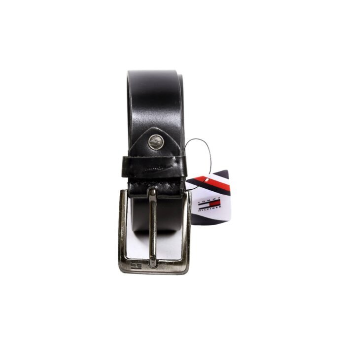 Tommy Hilfiger Black Color Leather Belt <div class="woocommerce-product-details__short-description"><strong>Belt Buckle:</strong> This is the hardware component, often made of metal, that secures the belt in place. Buckles can range from simple and minimalistic to ornate and decorative, with different shapes like square, oval, or horseshoe.</div> <div class="woocommerce-product-details__short-description"> <strong>Belt Holes:</strong> These are the evenly spaced perforations along one end of the belt, allowing you to adjust the fit by inserting the buckle's prong through the appropriate hole.</div> <div class="woocommerce-product-details__short-description"> <strong>Belt Width:</strong> Leather belts come in various widths, typically ranging from 1 to 2 inches. Narrower belts are often more formal, while wider belts are commonly used in casual or workwear settings.</div> <div class="woocommerce-product-details__short-description"> <strong>Stitching:</strong> Many leather belts feature stitching along the edges to enhance durability and add visual detail. The thread color can contrast or match the leather, depending on the design.</div>